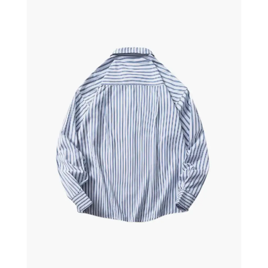 Striped cotton overshirt in light blue, side profile showing relaxed hem length