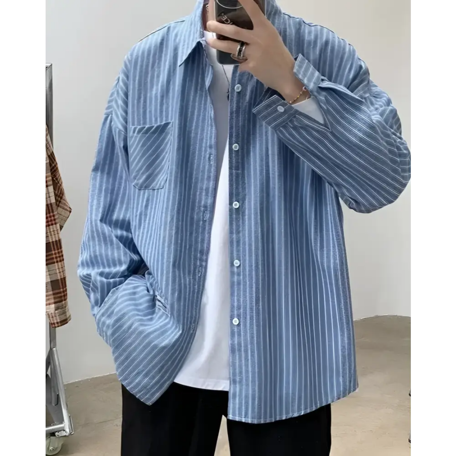 Blue striped cotton overshirt worn open over crewneck, relaxed fit