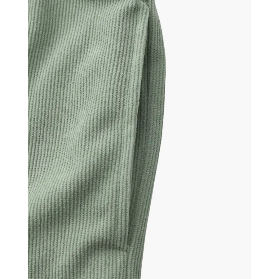 Corduroy shorts styled with linen shirt and natural layers overhead