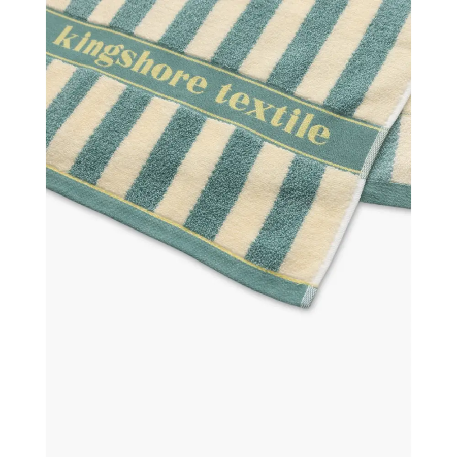 Navy and green striped towels stacked, showing color options side by side