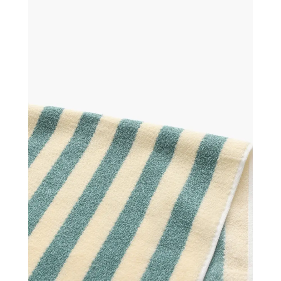 Navy striped towel in guest bathroom, styled with minimal decor