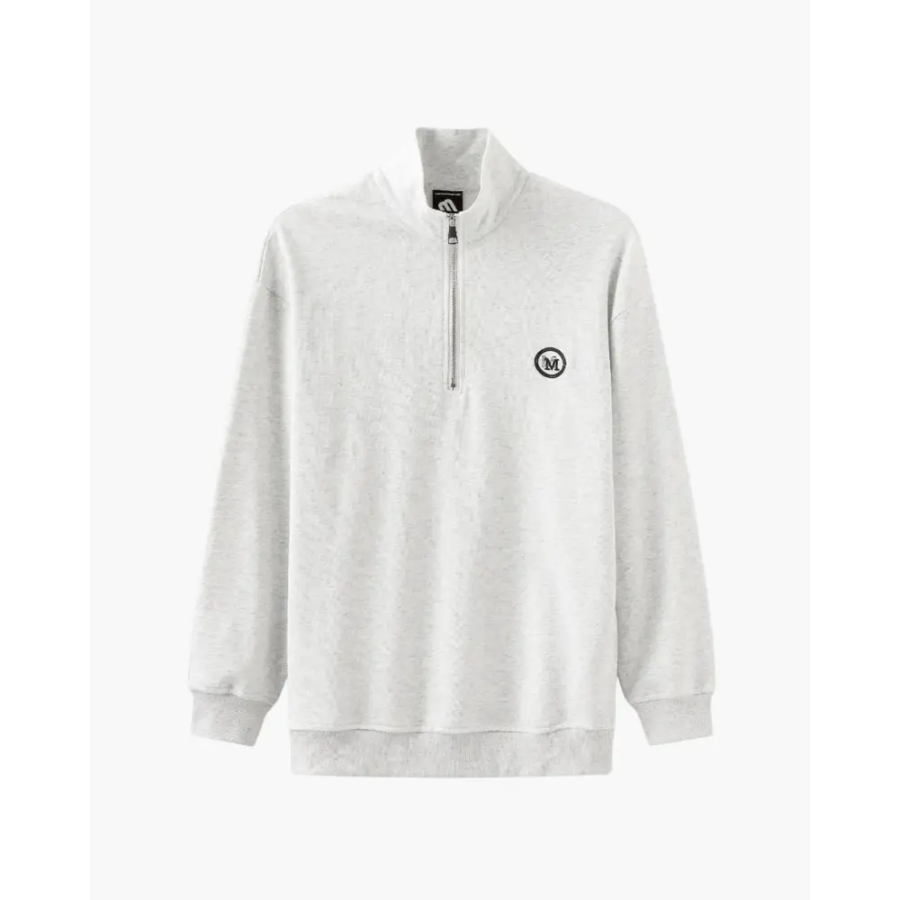 Gray half-zip pullover sweatshirt styled with jeans