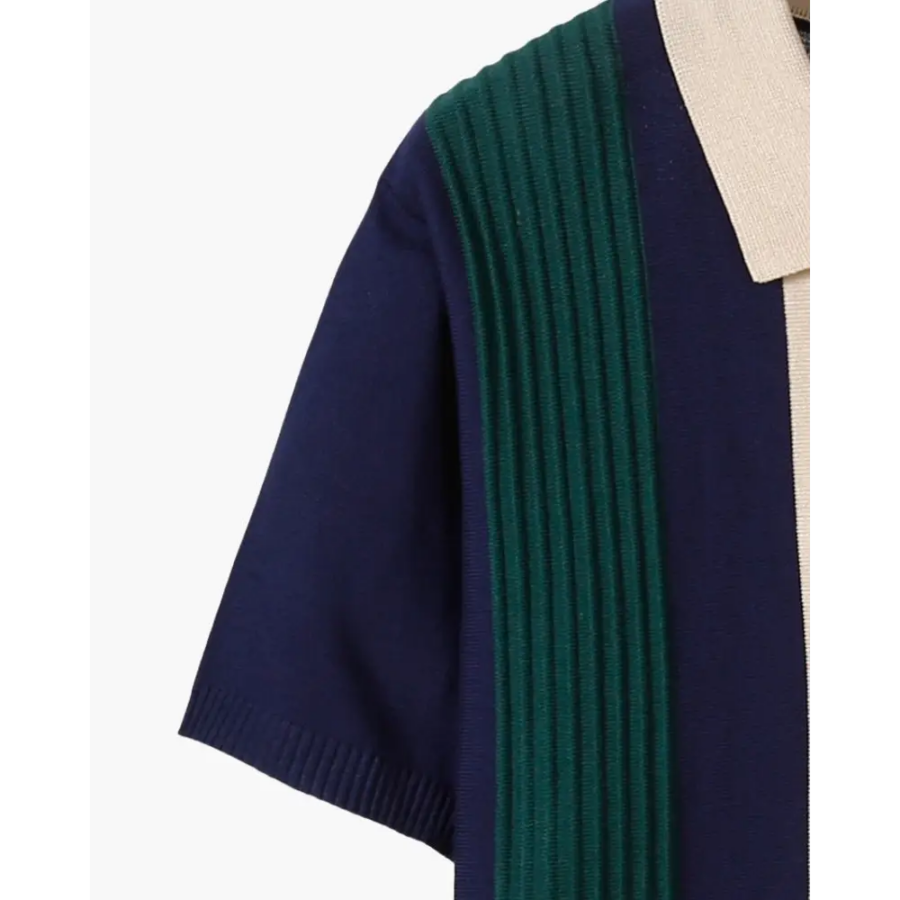 Contrast collar polo shirt layered under casual cardigan, demonstrating structured fit through shoulders