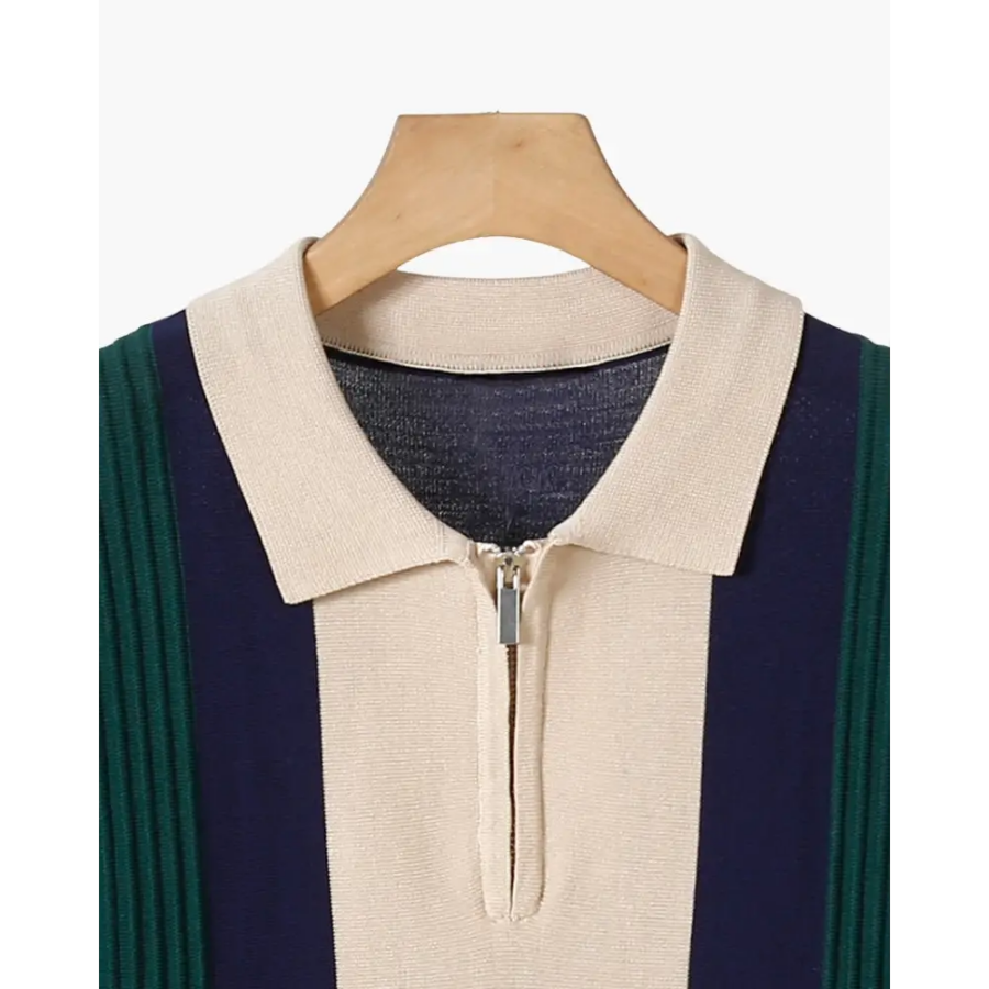 Close-up of vertical ribbed texture on contrast collar polo, detail of metal zip and refined collar finish