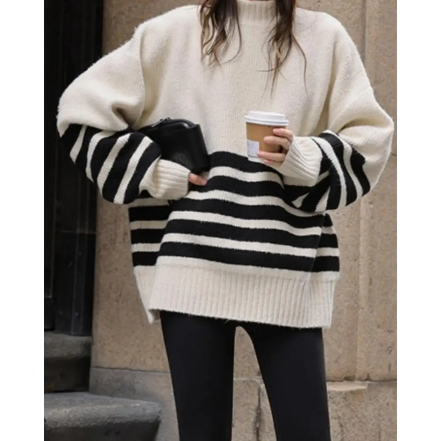 Cream stripe sweater styled with navy trousers and suede loafers, casual layering
