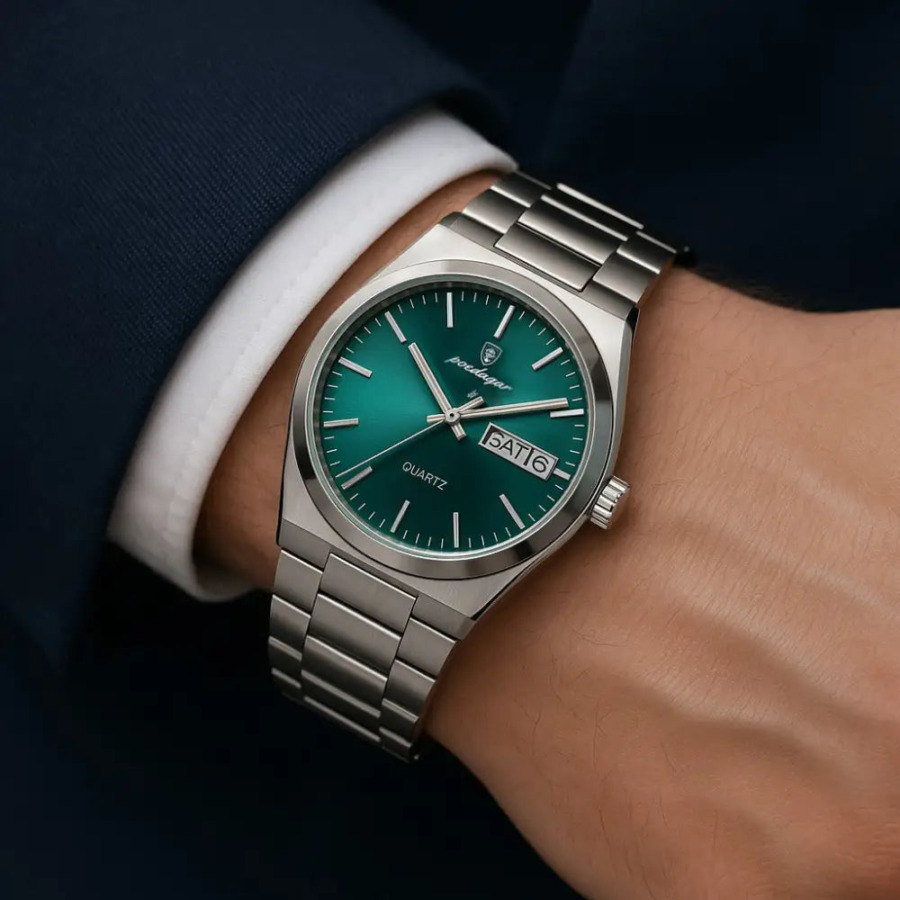 Emerald steel watch detail: date window at 3 o'clock, polished stainless case