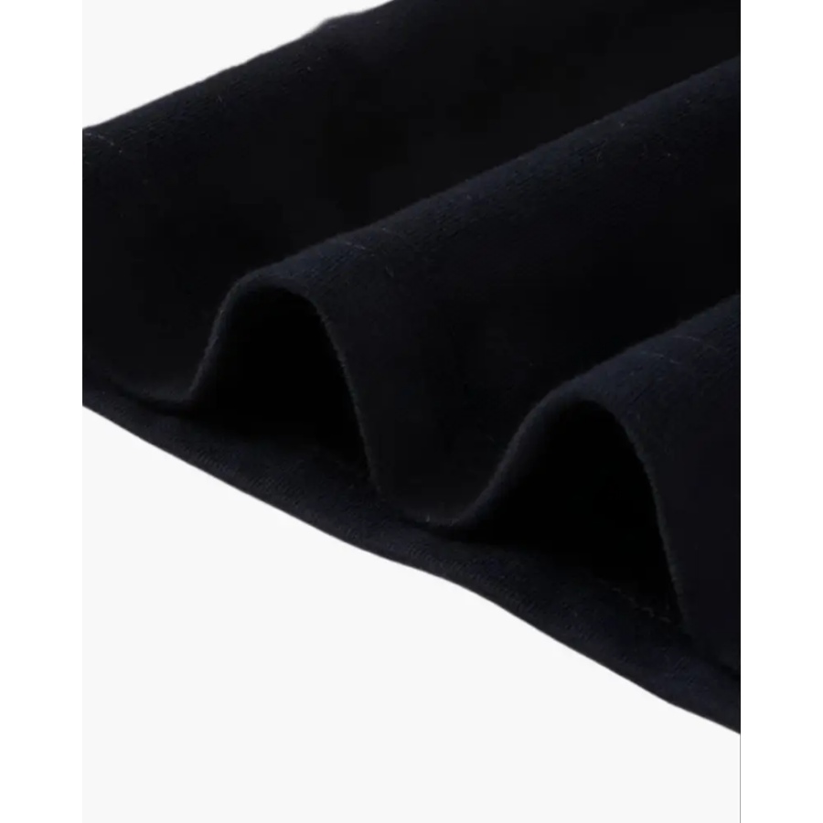 Como polo worn, showing relaxed fit and length at hip