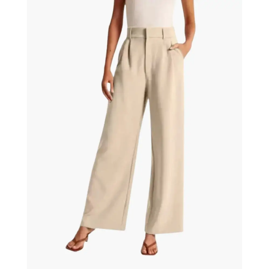 Beige fluid tailored trousers, relaxed fit, side profile