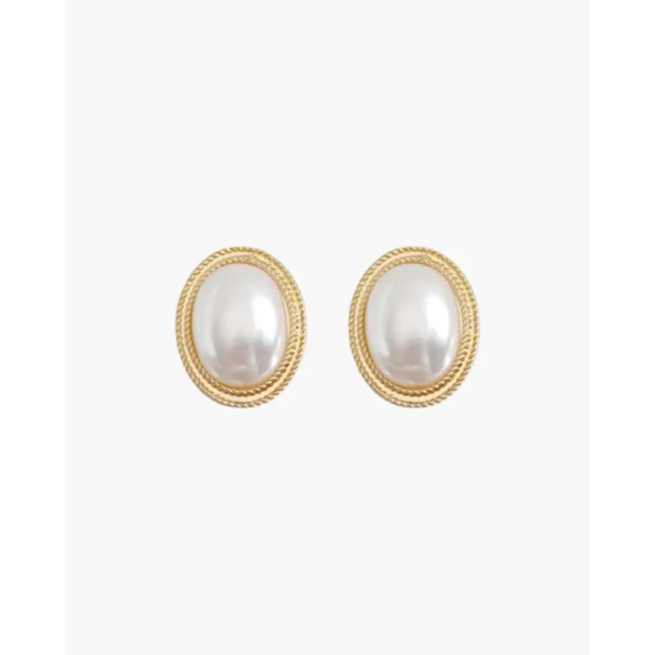 Gold oval pearl studs on ear, 8mm face with surgical steel post