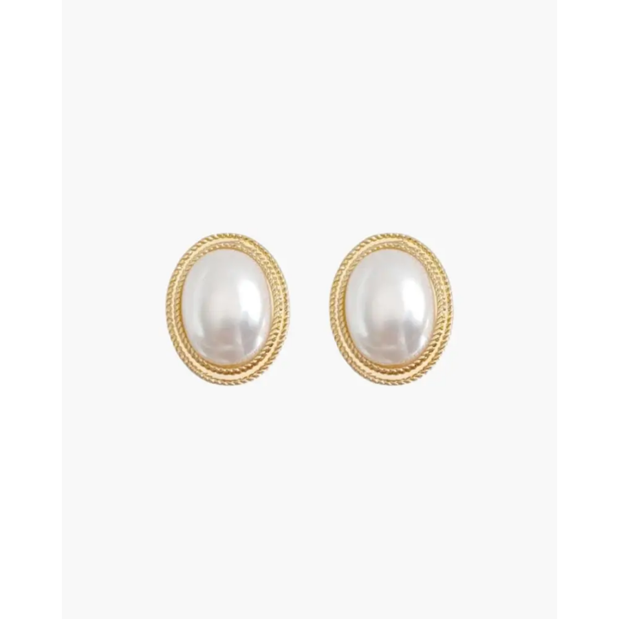 Gold oval pearl studs on ear, 8mm face with surgical steel post