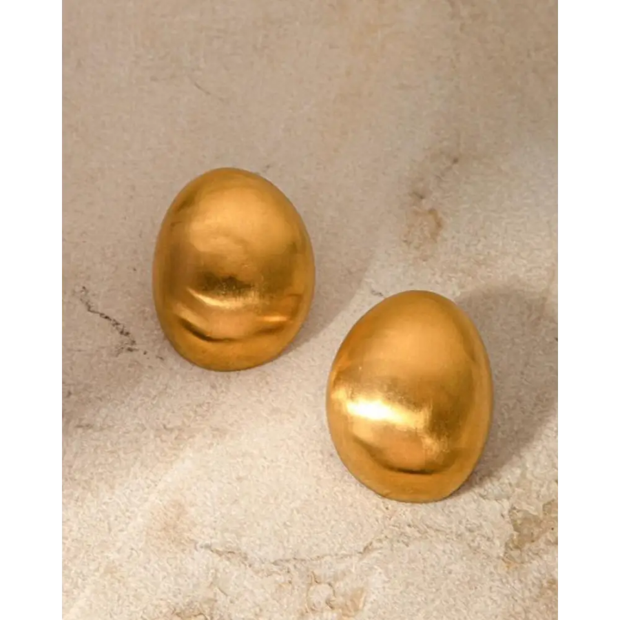Gold shield earrings with branded pouch and care card included