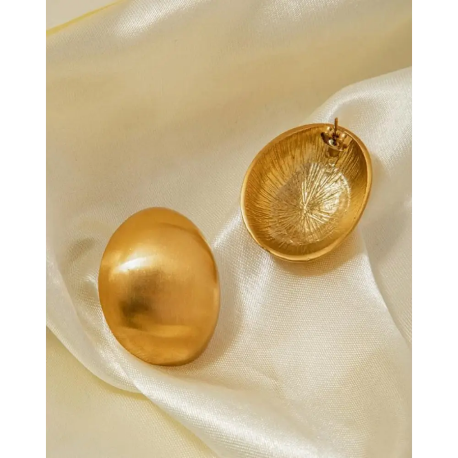Brushed brass shield earrings detail, oxidized patina and surgical steel posts