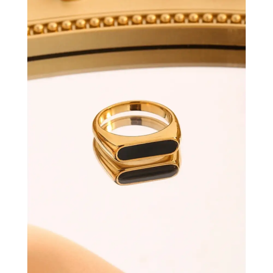 Size 8 signet ring worn, showing polished gold and matte enamel contrast