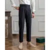 Black high waist tailored trousers, straight leg silhouette, three-quarter front view