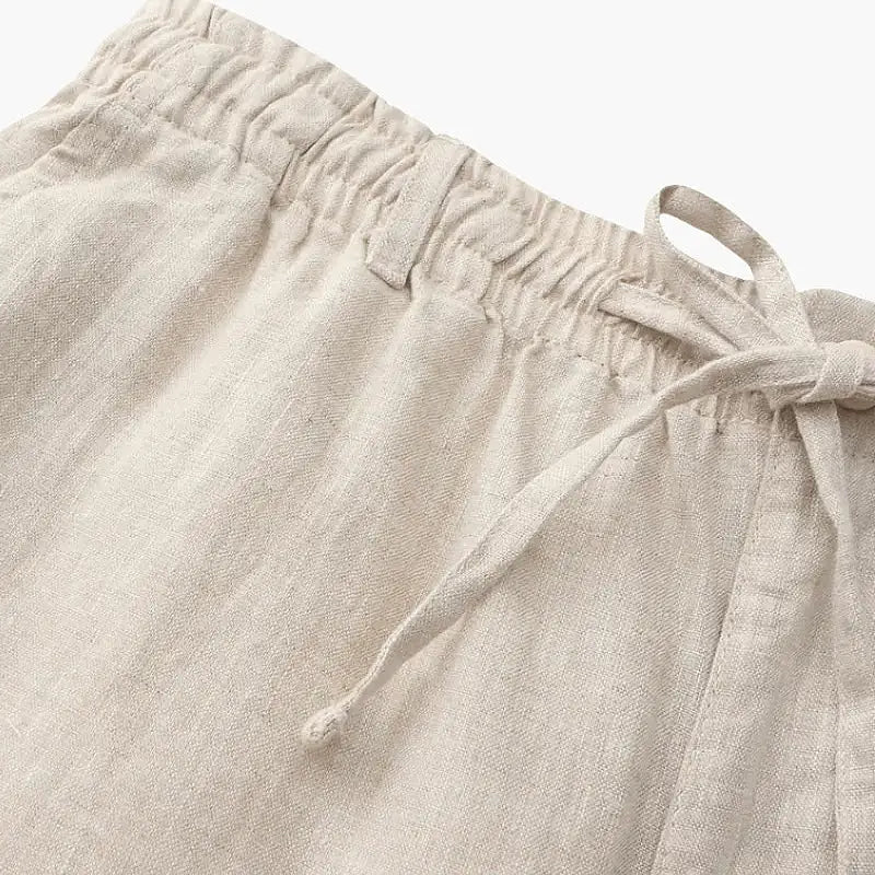Tailored linen blend shorts worn with classic oxford shirt and loafers