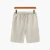 Beige tailored linen blend shorts front view, size small