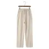 Linen drawstring trousers in beige, size small, flat lay showing fabric drape