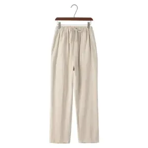 Linen drawstring trousers in beige, size small, flat lay showing fabric drape