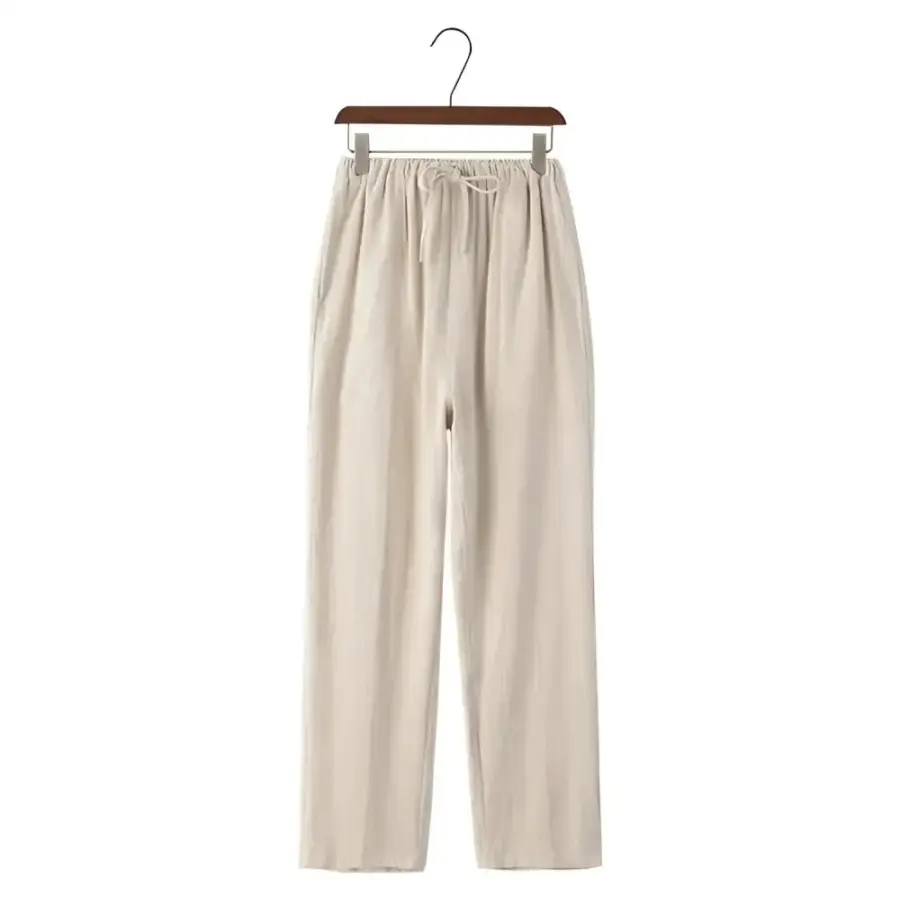 Linen drawstring trousers in beige, size small, flat lay showing fabric drape