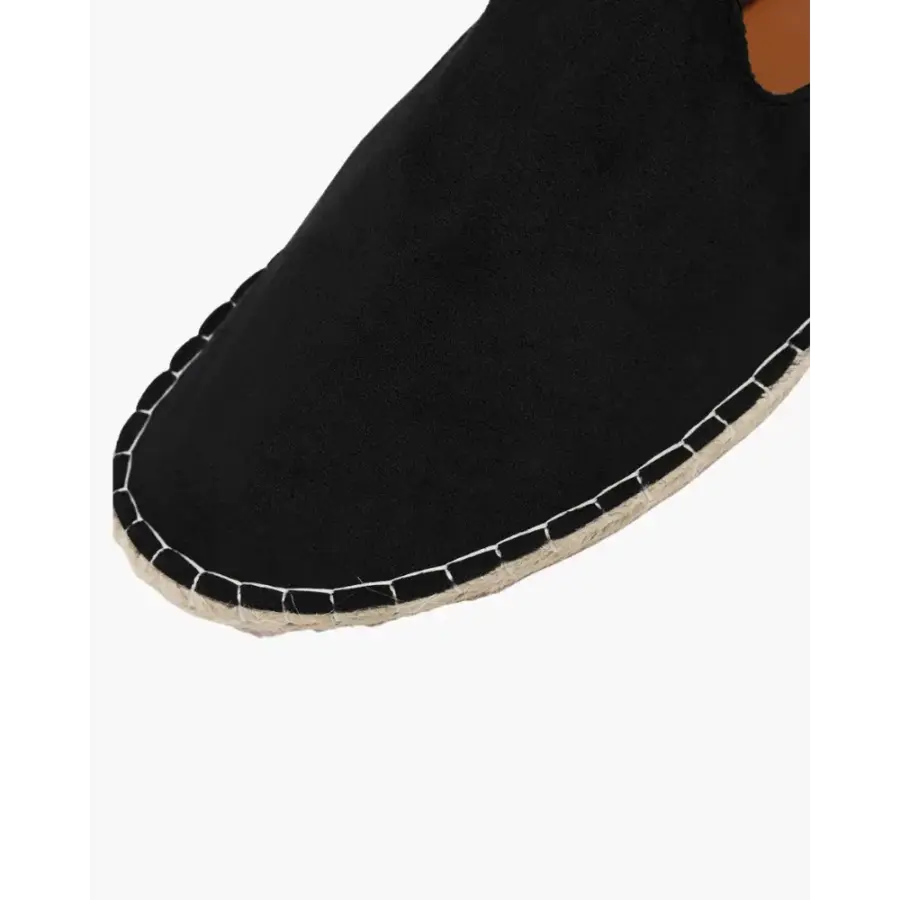 Top-down view of minimalist jute espadrille with sheepskin wool lining visible