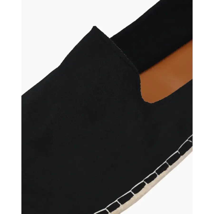 Full view of minimalist espadrille showing canvas construction and minimal branding