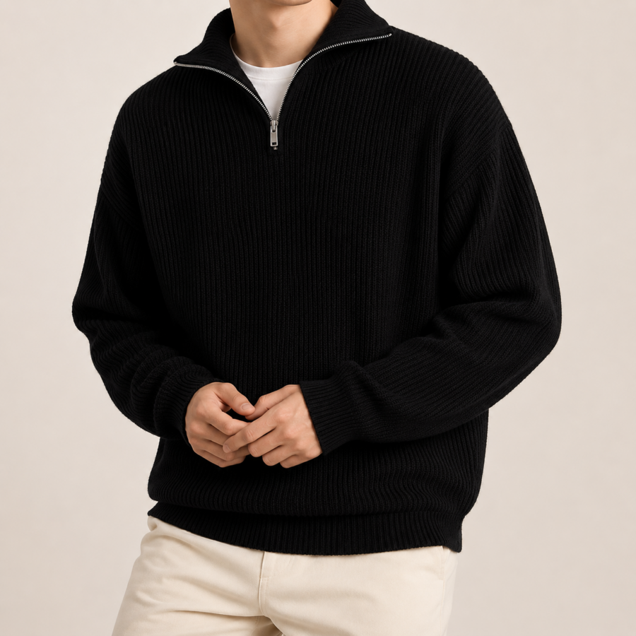Minimalist cotton quarter-zip sweater with relaxed fit and drop shoulders, shown in cream color on model, front view