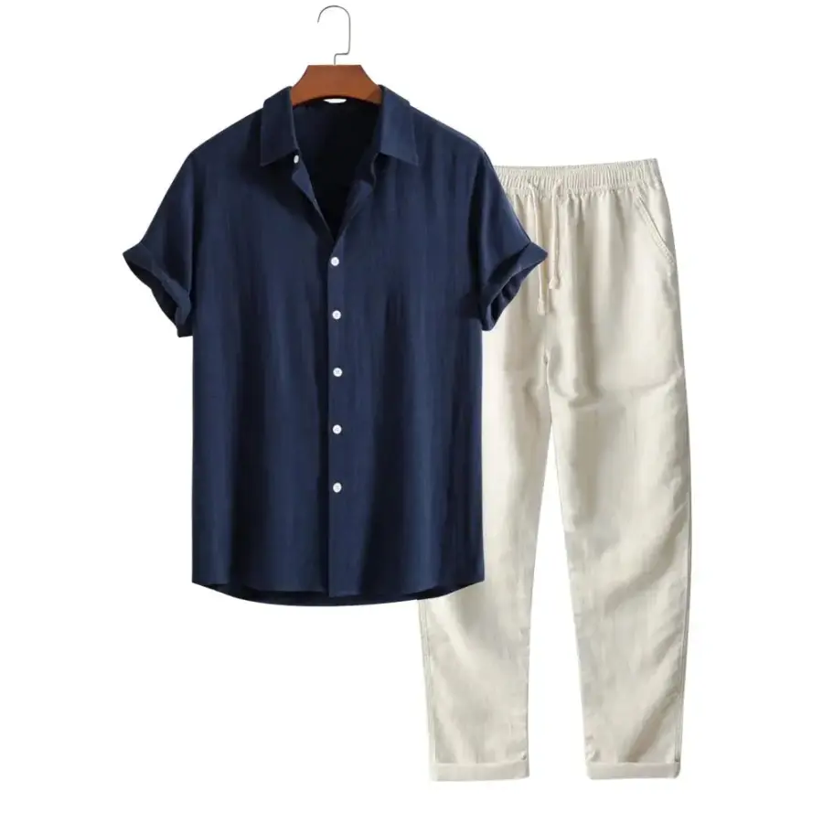 Navy linen shirt and cream trousers outfit set in size small, flat lay on neutral background