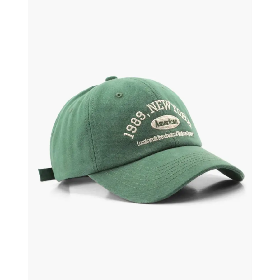 Green cotton baseball cap, detail of fabric texture and weave