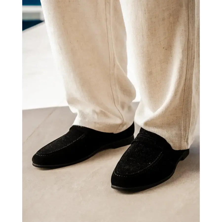 Suede loafer sole detail, stitched leather construction, ready for resoling