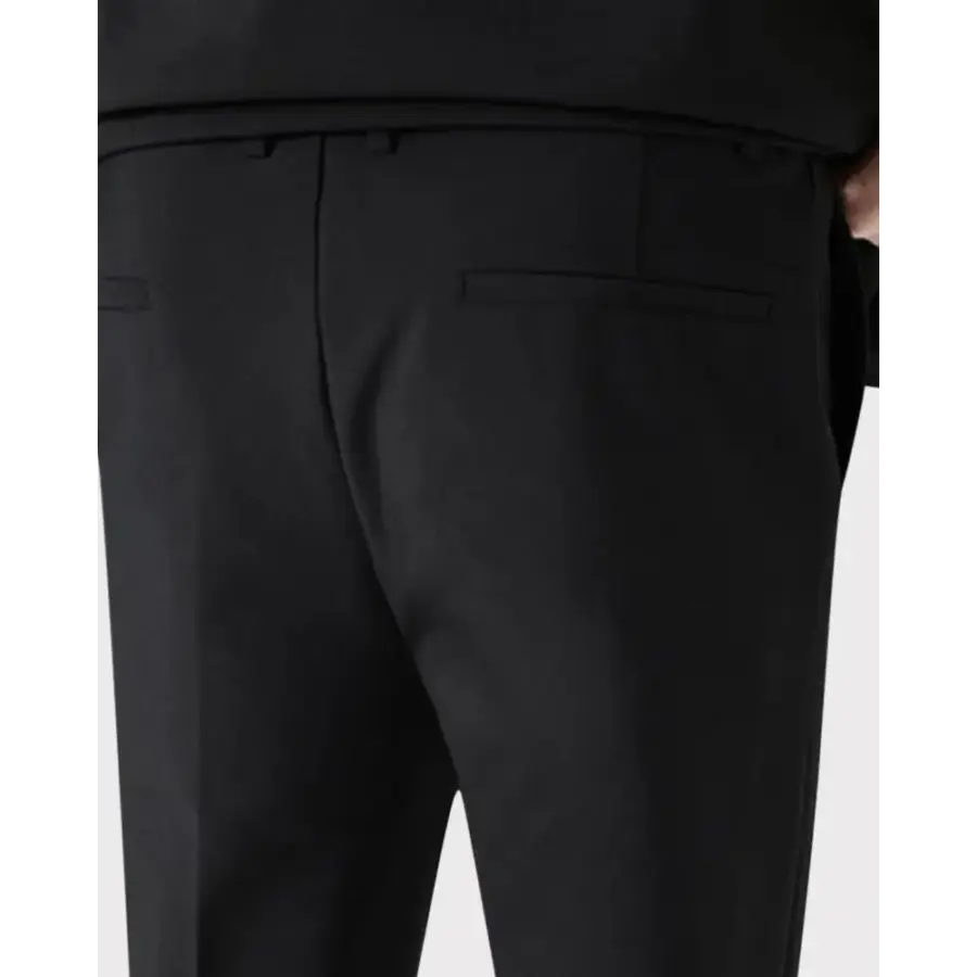 Black blazer and pants two-piece set, structured jacket shoulder detail