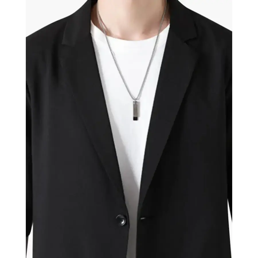 Old money two-piece blazer set in black, notched lapel detail close-up