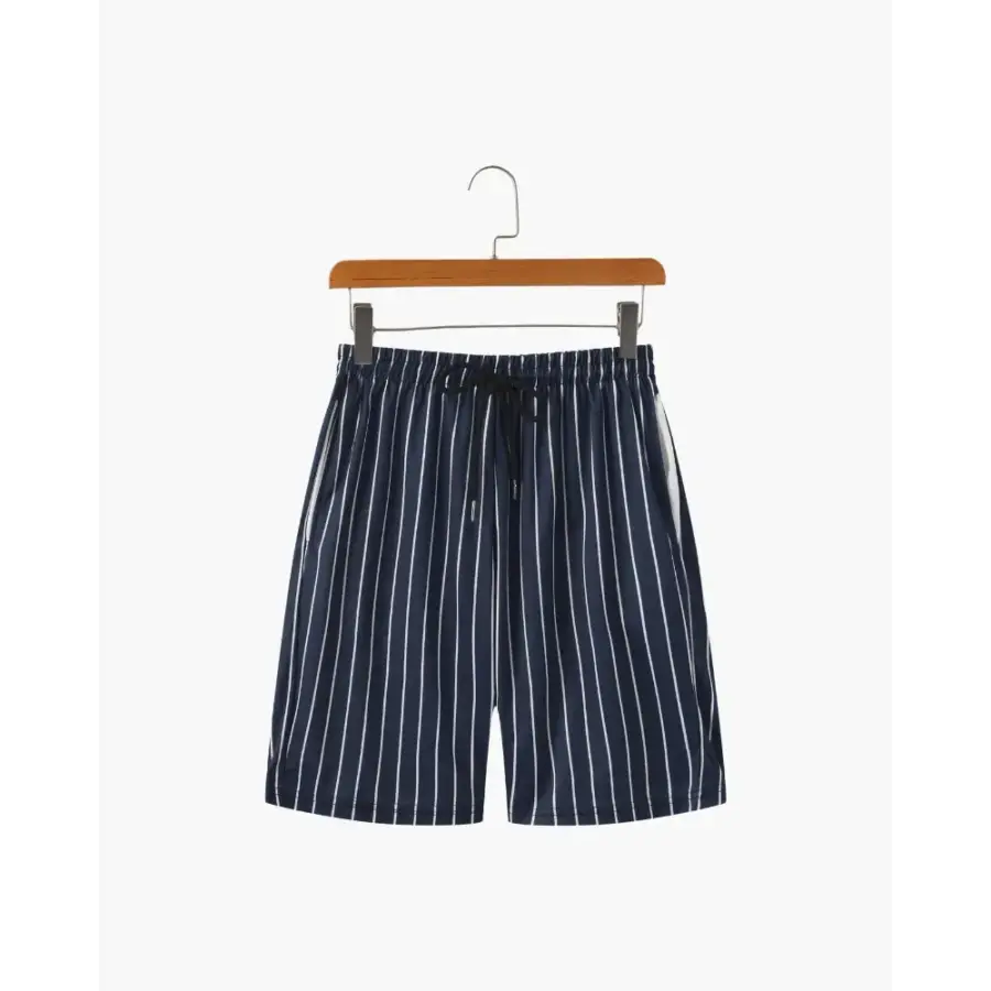 Riviera swim briefs in navy with vertical stripe detail, worn view showing quick-dry fabric and fit