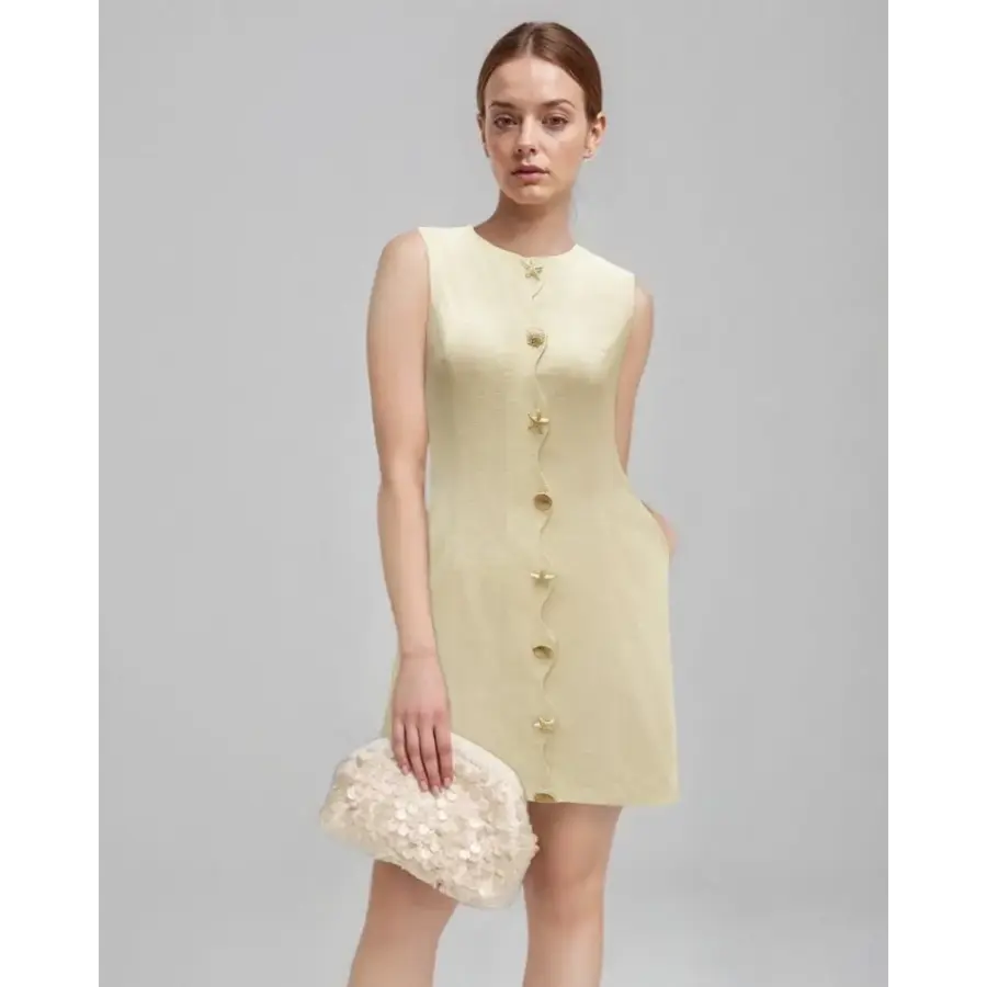 Beige mini dress back view showing hidden zip closure and curved seams