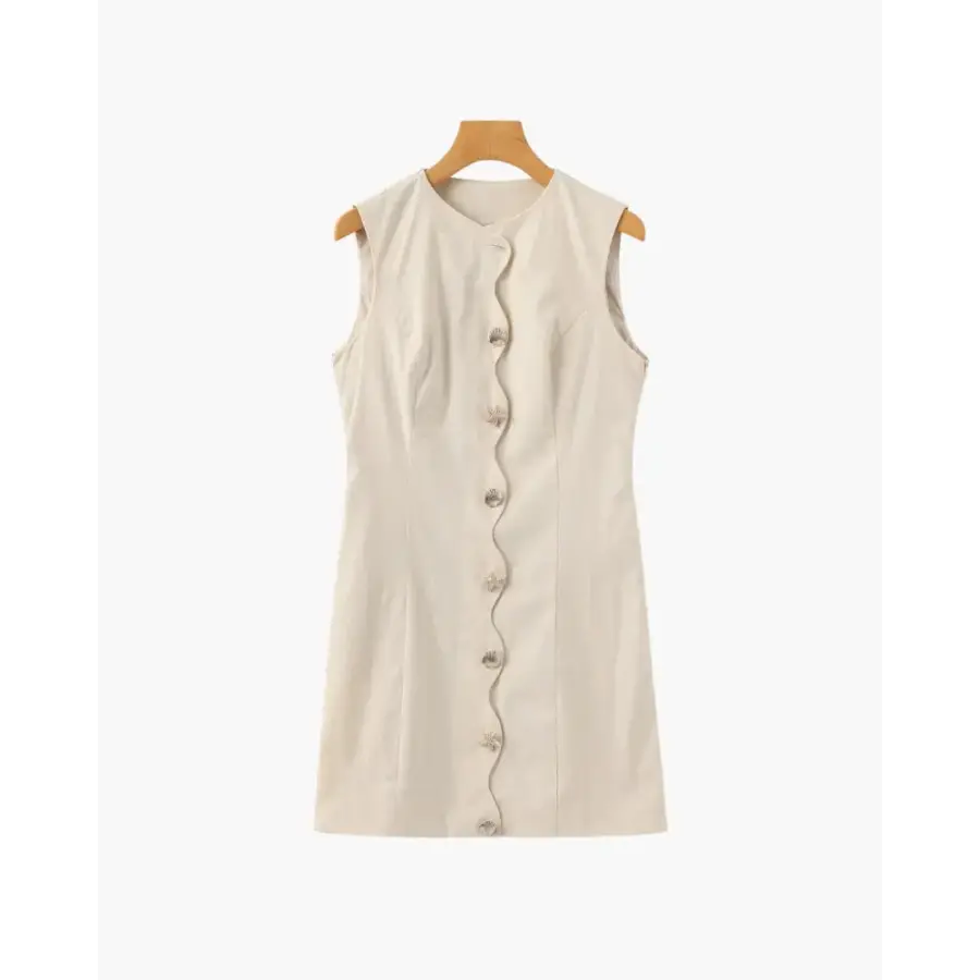 Sculpted beige mini shell dress front view, size S, showing wavy button placket detail