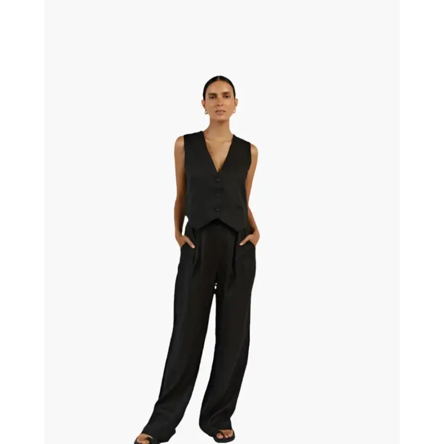 Sleeveless jumpsuit side profile highlighting elongated leg line and fit
