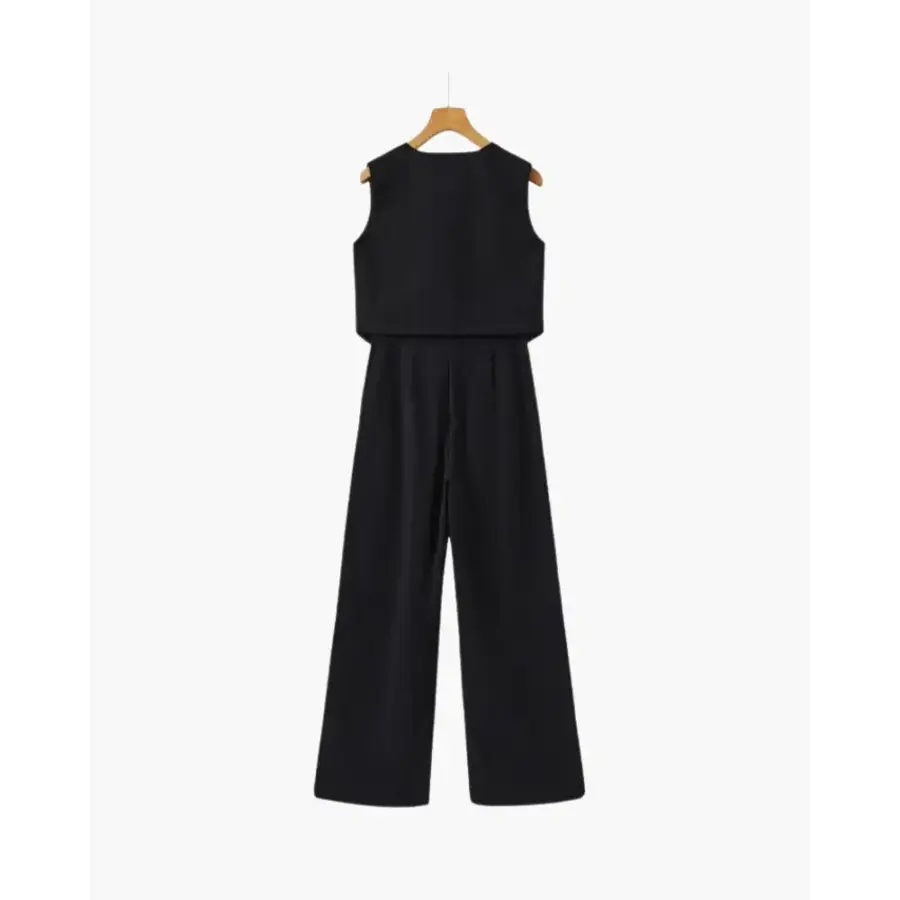 Wide-leg jumpsuit styled with minimal accessories and neutral tones