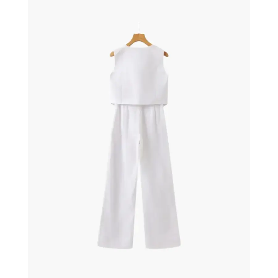 Sleeveless jumpsuit back view demonstrating tailored drape and fit through hips