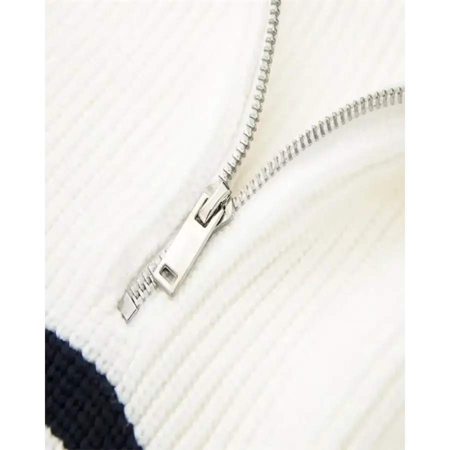 The Mariner Zip Knit flat lay, showing sleeve taper and zip detail
