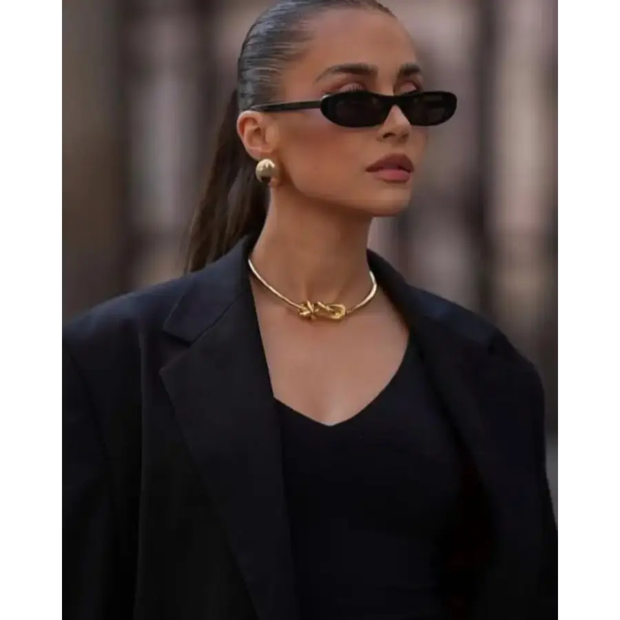 Oval frame sunglasses side profile showing narrow bridge and slim temples