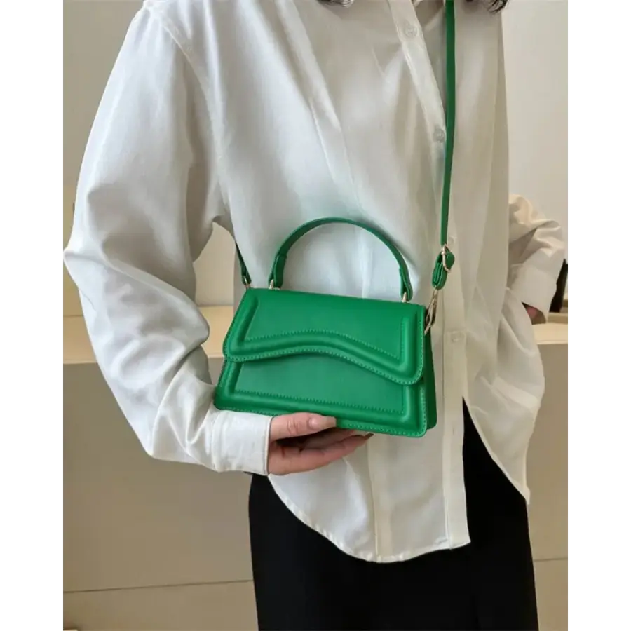 Petite top-handle bag structured canvas form, neutral background