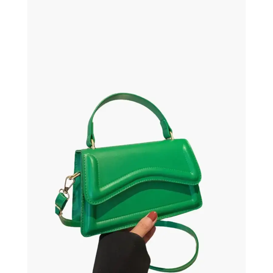 Petite top-handle bag in green canvas, side profile showing handle detail
