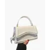 Petite top-handle bag in white canvas with leather handle, front view