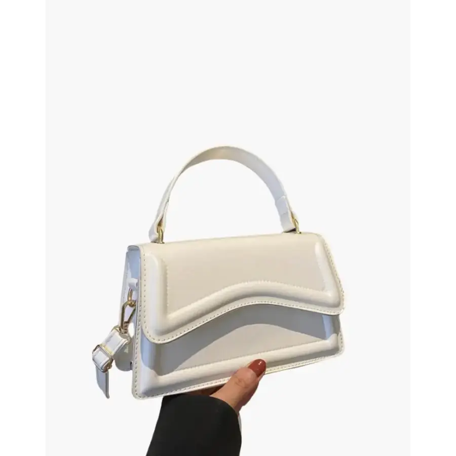 Petite top-handle bag in white canvas with leather handle, front view
