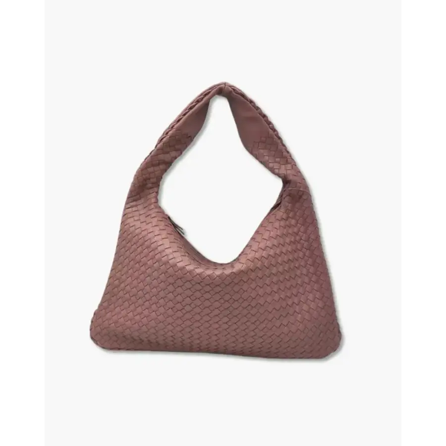 Sculpted Shoulder Bag lifestyle image showing structured form when set down empty