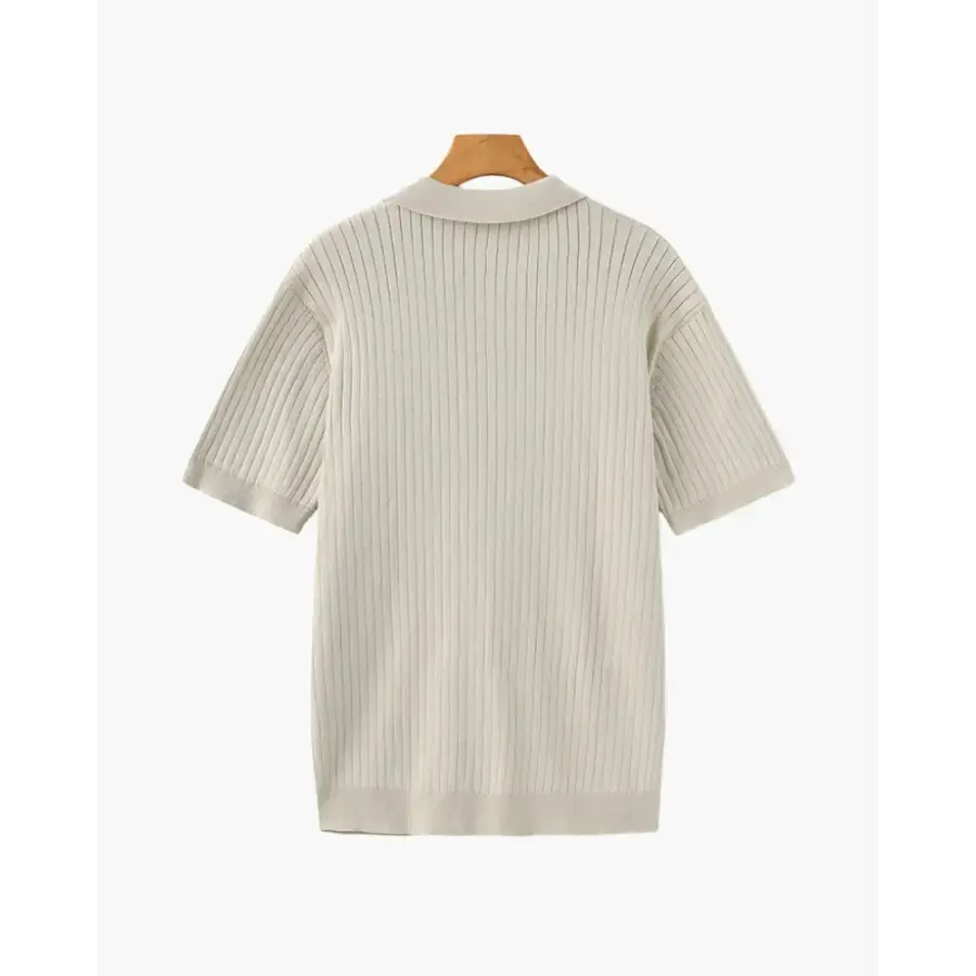Ribbed cotton polo worn layered under linen blazer
