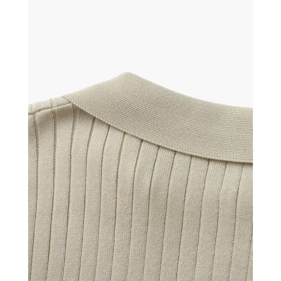 Ribbed cotton polo worn solo at weekend lunch, understated styling