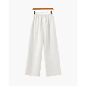 Palais wide-leg trousers in ivory, high-rise fit, full-length view