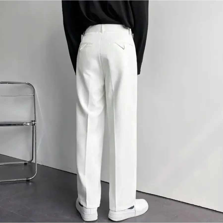 Ankle opening and hem of black relaxed trousers